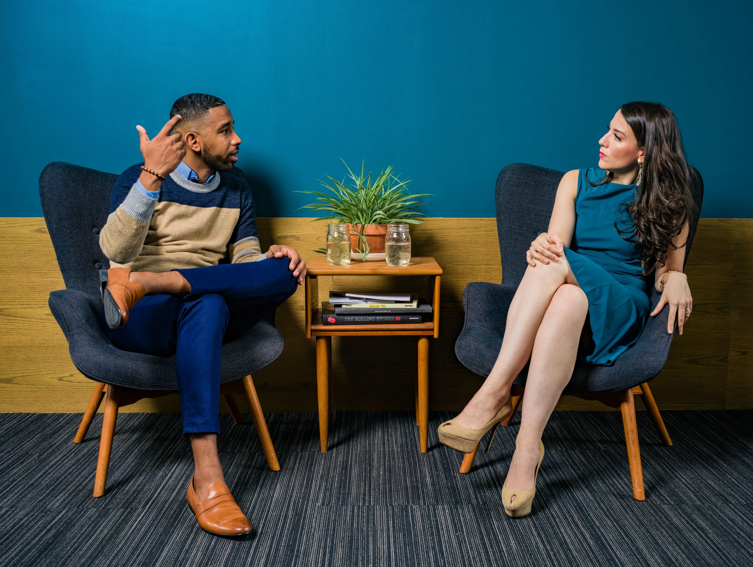 Man and woman sitting and talking Exponent Partners Northeast Dreamin 22'